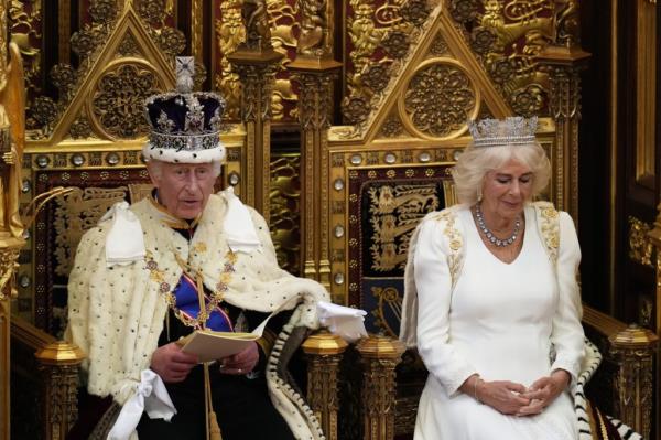 King Charles III reading the King's Speech with Queen Camilla beside him during the State Opening of Parliament in the House of Lords, Lo<em></em>ndon in 2024