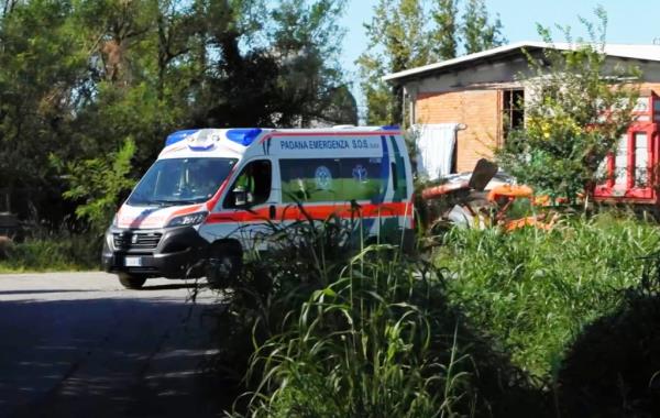 An emergency vehicle is seen at the scene of the collapse in Romano di Lombardia