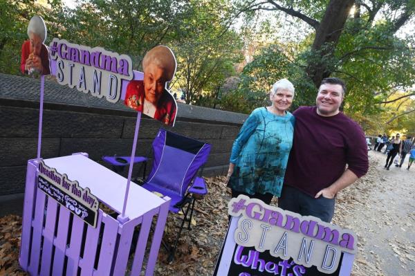 Grandma Sharon Fitzpatrick and Mike Matthews pose together by the Grandma Stand