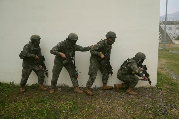 In South Korea, all able-bodied men are required to serve a<em></em>bout 18-21 mo<em></em>nths in the military under a cons<em></em>cription system established to maintain readiness against potential aggressions from rival North Korea.
