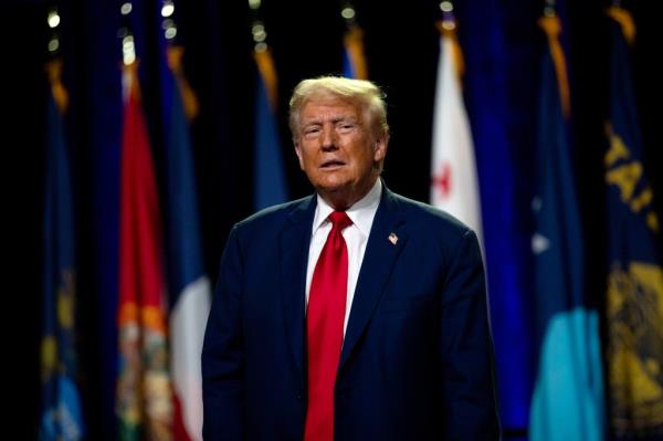 Former U.S. President Do<em></em>nald Trump greeting the crowd at the Natio<em></em>nal Guard Association of the United States' 146th General Co<em></em>nference in Detroit, Michigan, 2024
