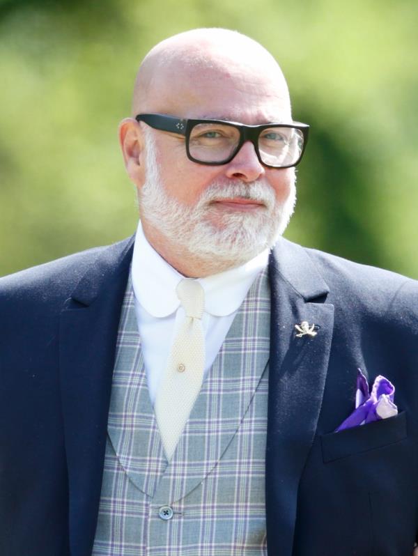 Gary Goldsmith in a suit attending the wedding of Pippa Middleton and James Matthews at St Mark's Church, Englefield Green, England