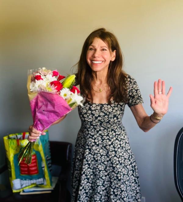 Theresa Nist with flowers. 