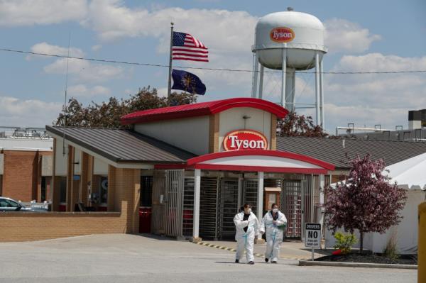 Workers leaving Tyson Foods pork processing plant in Logansport, Ind., with a high vaccination rate reported