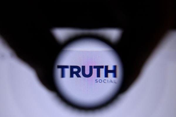 Truth Social logo in magnifying glass.