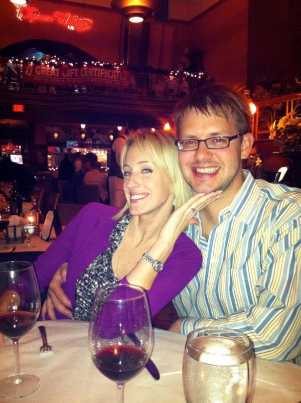 Kristy Stark and her husband, physician Owen Stark, smiling close together at a restaurant.