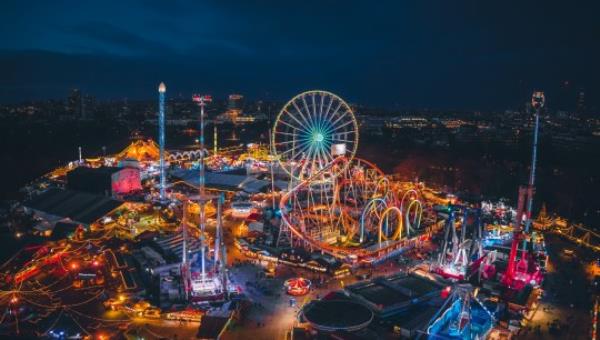 Aerial view of Christmas themed colourful amusement park and Christmas market Winter Wo<em></em>nderland in Hyde Park, London, UK. Destination open from November to January