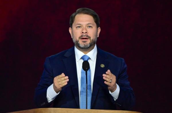 United States Representative Ruben Gallego speaking into a microphone at the 2024 Democratic Natio<em></em>nal Convention