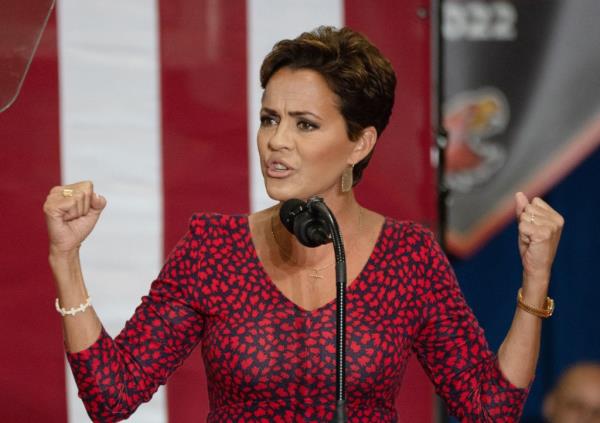 US Republican Senate candidate for Arizona, Kari Lake, speaking at a campaign rally at Arizona Christian University Event Center in a red dress
