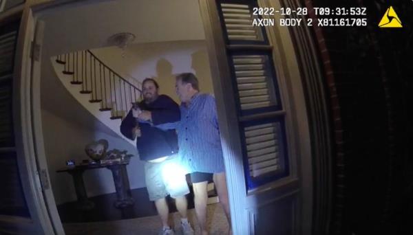 FILE - In this image taken from San Francisco Police Department body camera video, the husband of former U.S. House Speaker Nancy Pelosi, Paul Pelosi, right, fights for co<em></em>ntrol of a hammer with his assailant, David DePape, during a brutal attack in the couple's San Francisco home, Oct. 28, 2022