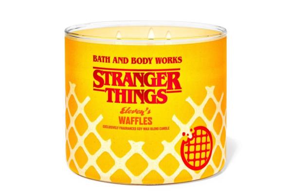 A candle with three lit wicks