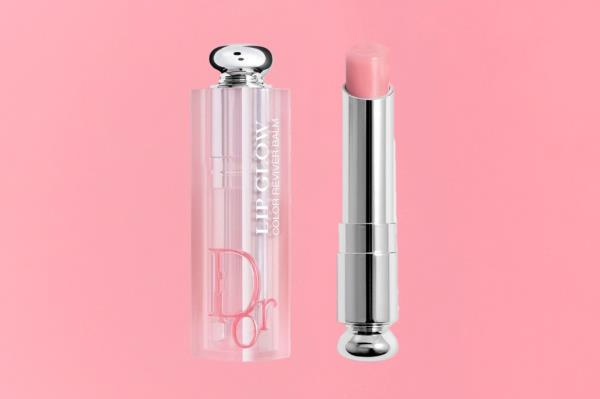 A pink lipgloss in a tube on a gift guide cover