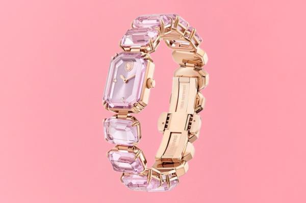 A decorative watch embellished with purple sto<em></em>nes featured on a gift guide cover, photographed by Marshall Troy.