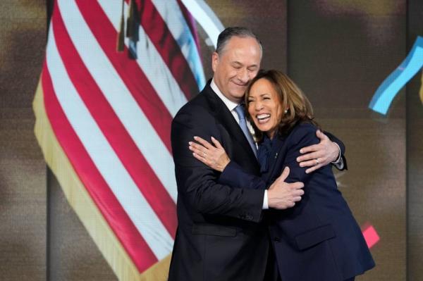 Democratic presidential nominee Vice President Kamala Harris is joined on stage by second gentleman Doug Emhoff after she delivered an acceptance speech during the final day of the Democratic Natio<em></em>nal Co<em></em>nvention at the United Center.