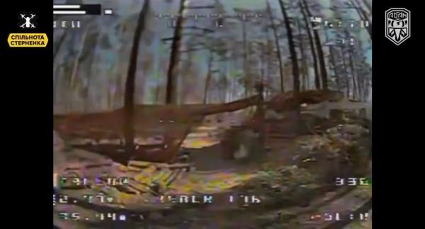 The drone locates the dugout shielded by netting