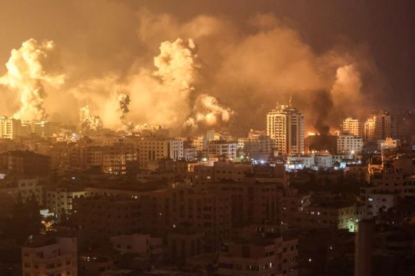 Flames and smoke billow during Israeli strikes in Gaza on Oct. 9, 2023, in Palestine.  