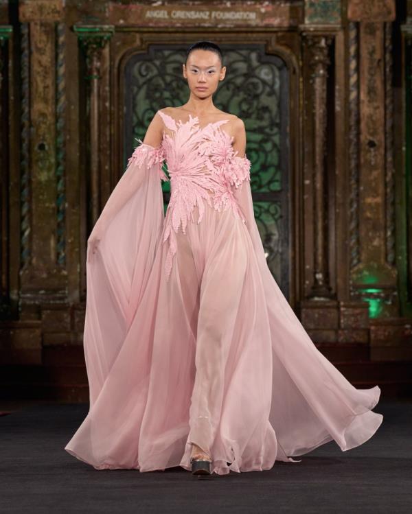 A woman in a pink dress at the Naeem Khan New York Fashion Week