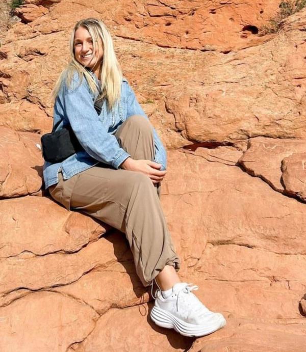 Lexie Firment sitting on rocks
