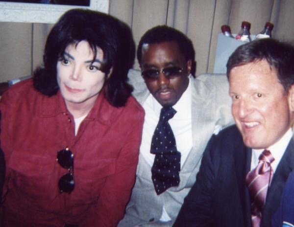 Michael Jackson, Sean P. Diddy Combs, and Ron Burkle posing for a photo at The Return of Gatsby 2003 MTV Movie Awards Post Party