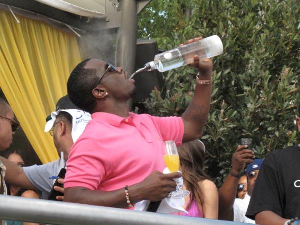 Sean 'Diddy' Combs hosting and performing at Palms Pool, Las Vegas, with Akon and Christina Milian, pouring Ciroc into a glass