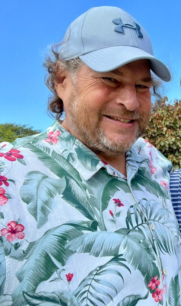 Marc Benioff, wearing a Hawaiian shirt and a hat, known for his recent billio<em></em>naire deal with Diddy's SalesForce