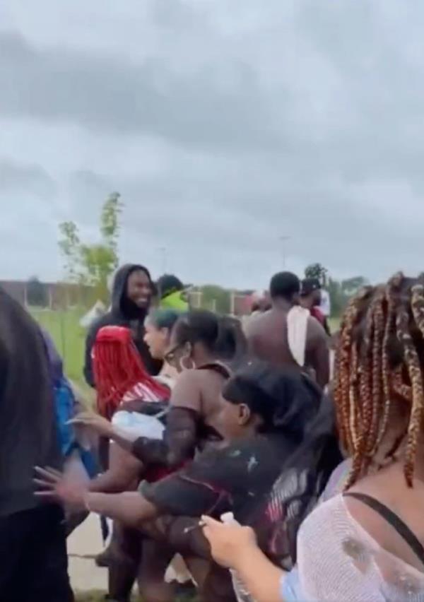 People reacting to the shooting at the festival.