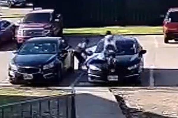 Girl jumps o<em></em>nto car