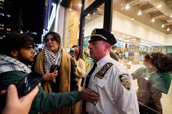 Pro-Palestinian protesters clash with police officers at a protest on Monday.