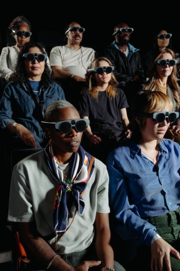 Audience of people wearing virtual reality goggles