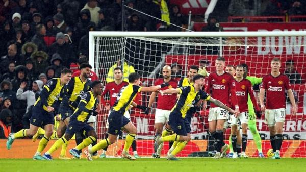 Marcos Senesi (centre right) celebrates after scoring Bournemouth's third at Old Trafford