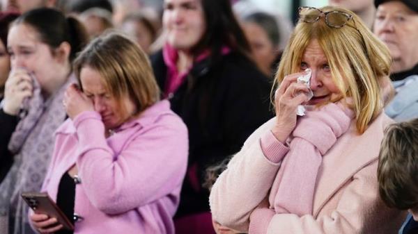 People, many wearing pink,  attending a vigil in Golden Square, Warrington, to mark the first anniversary of the murder of 16-year-old Brianna Ghey. Picture date: Sunday February 11, 2024. PA Photo. The teenager was stabbed with a hunting knife 28 times in her head, neck, chest and back after being lured by Scarlett Jenkinson and Eddie Ratcliffe to Linear Park on the afternoon of February 11 last year. See PA story MEMORIAL Warrington. Photo credit should read: Danny Lawson/PA Wire 