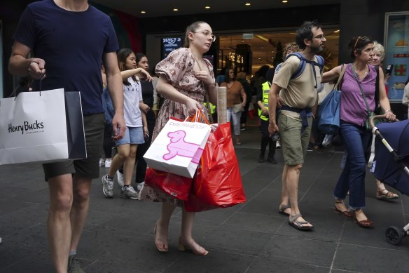 Seaso<em></em>nal gloom: Shoppers on Melbourne’s Bourke Street Mall.
